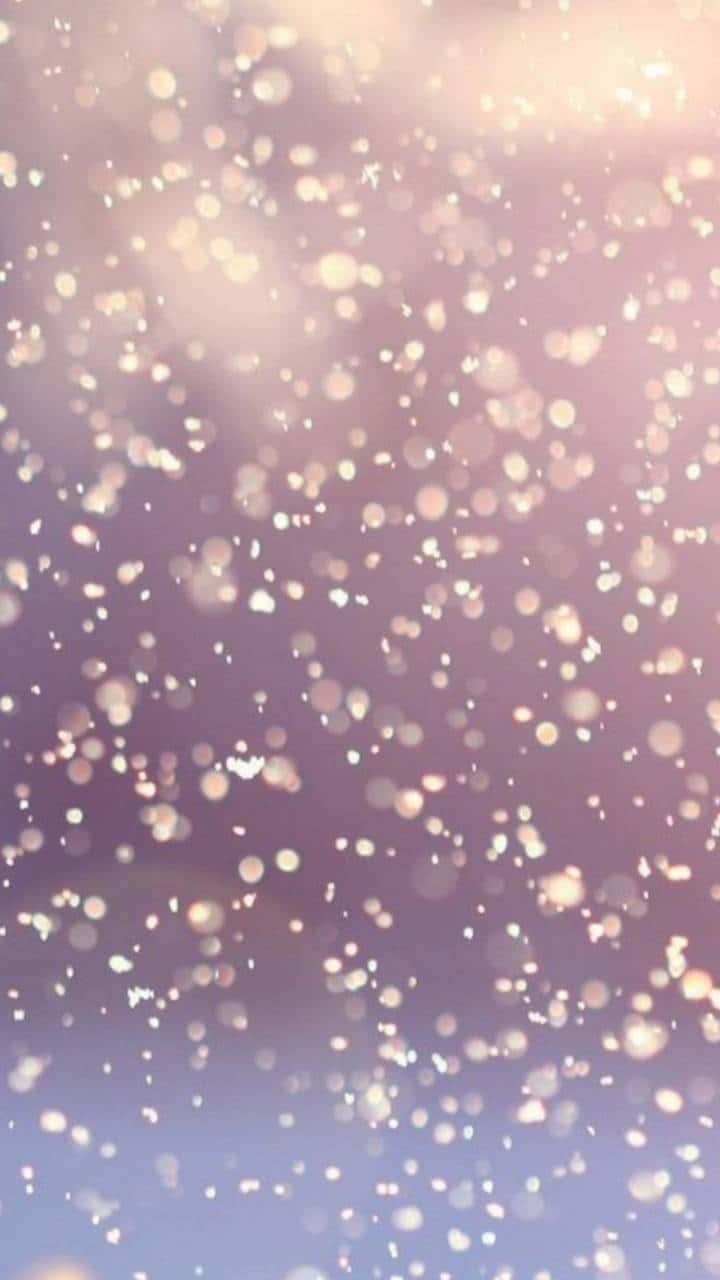Et lilla og rosa baggrundsdesign med snefnug Wallpaper