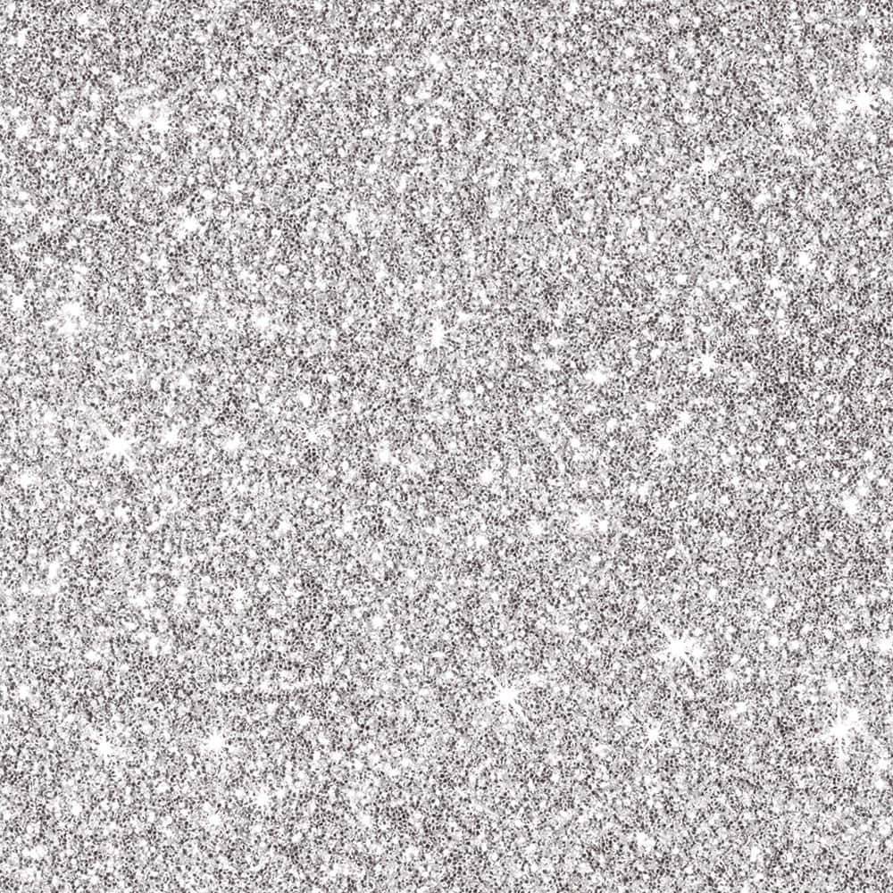 Et sølv glitrende baggrund med hvide stjerner
