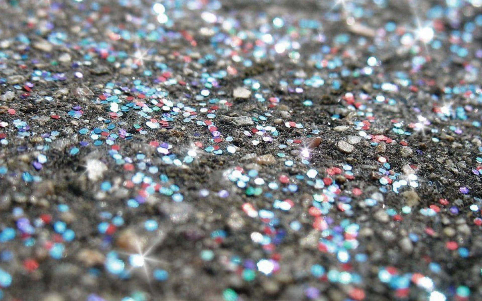 A Close Up Of Glitter On The Ground