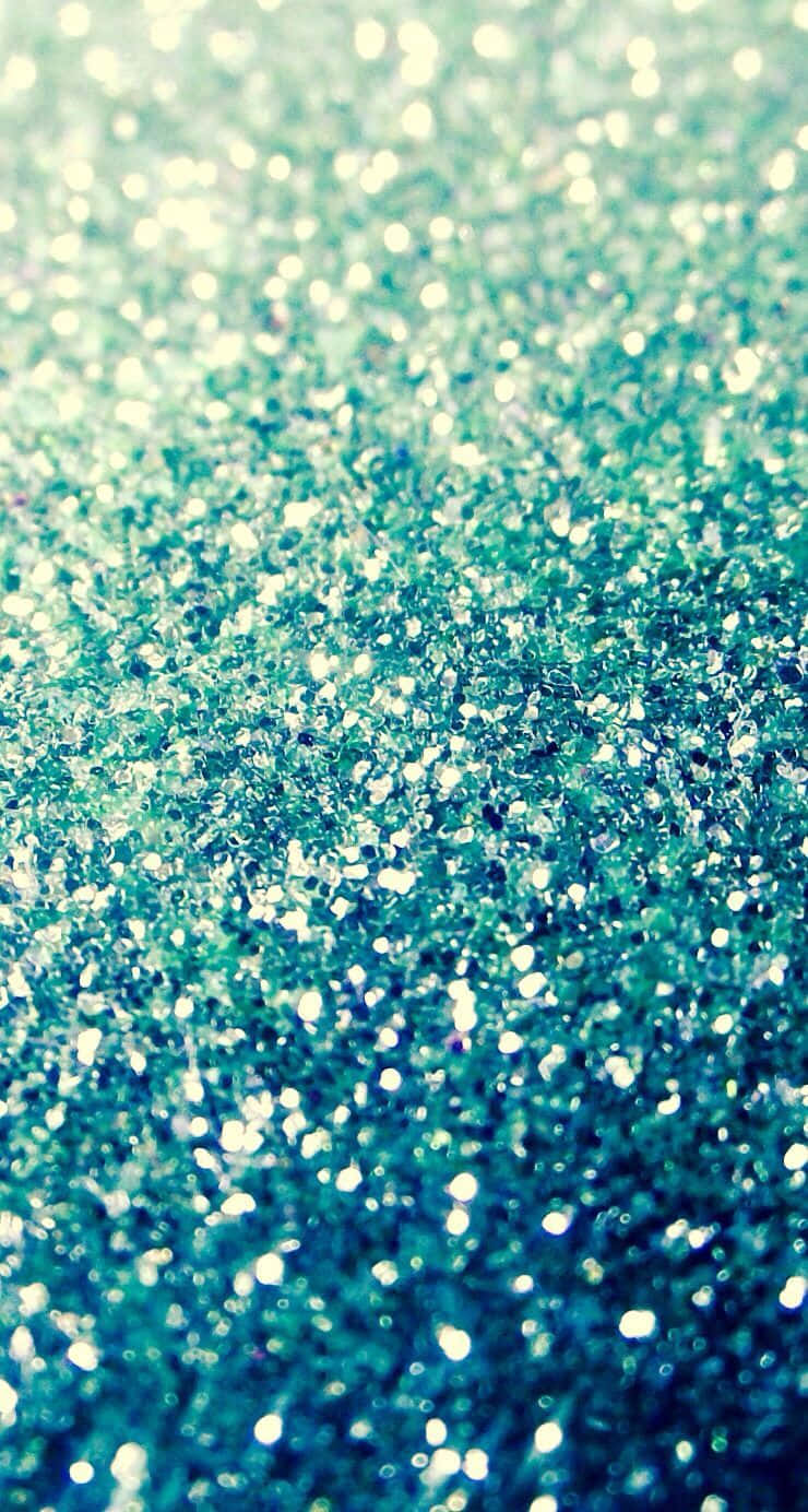 A Close Up Of A Blue And Green Glittery Surface