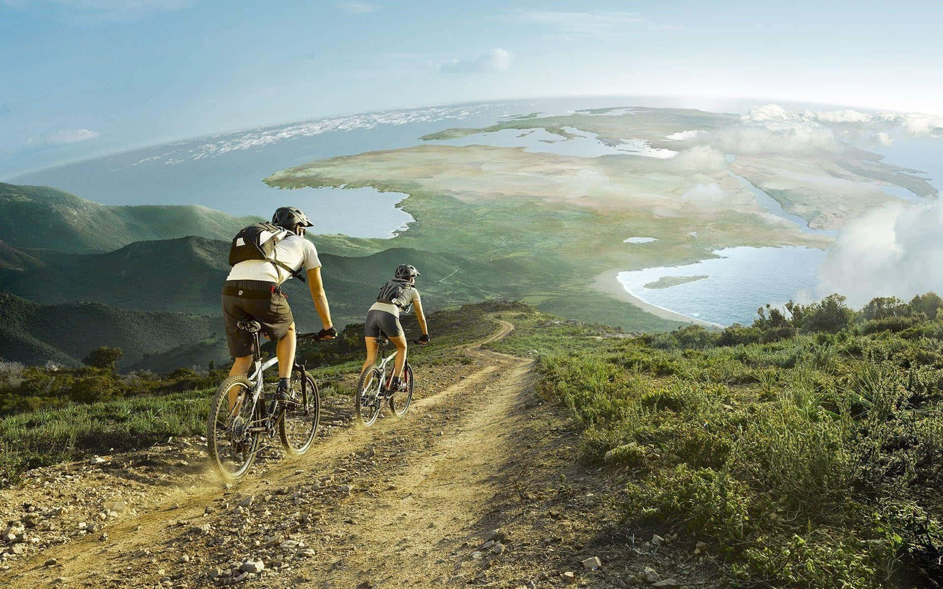 Dospersonas Montando Bicicletas En Un Camino De Tierra Fondo de pantalla