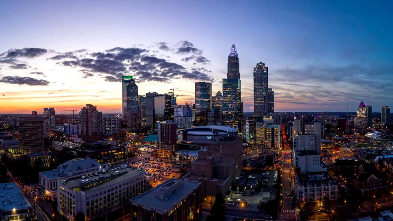 Spectacular View Of The Charlotte Skyline At Dawn Wallpaper