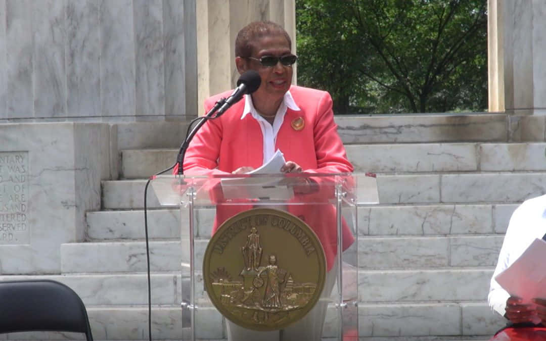 Speech Delivery Of Eleanor Holmes Norton On A Sunny Day Wallpaper