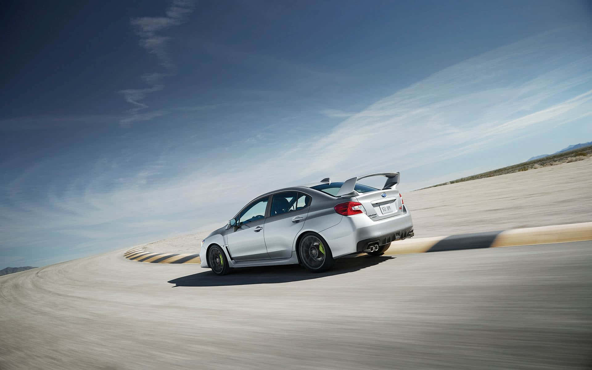 Speed Meets Elegance: The 2022 Subaru Wrx In Action Wallpaper