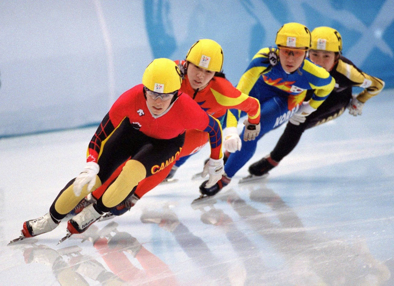 Fierce Competition at Speed Skating Championship Wallpaper