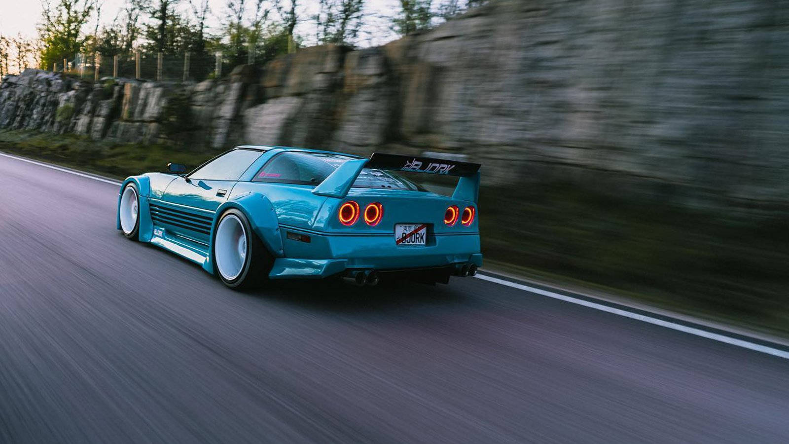 Speeding Blue C4 Corvette