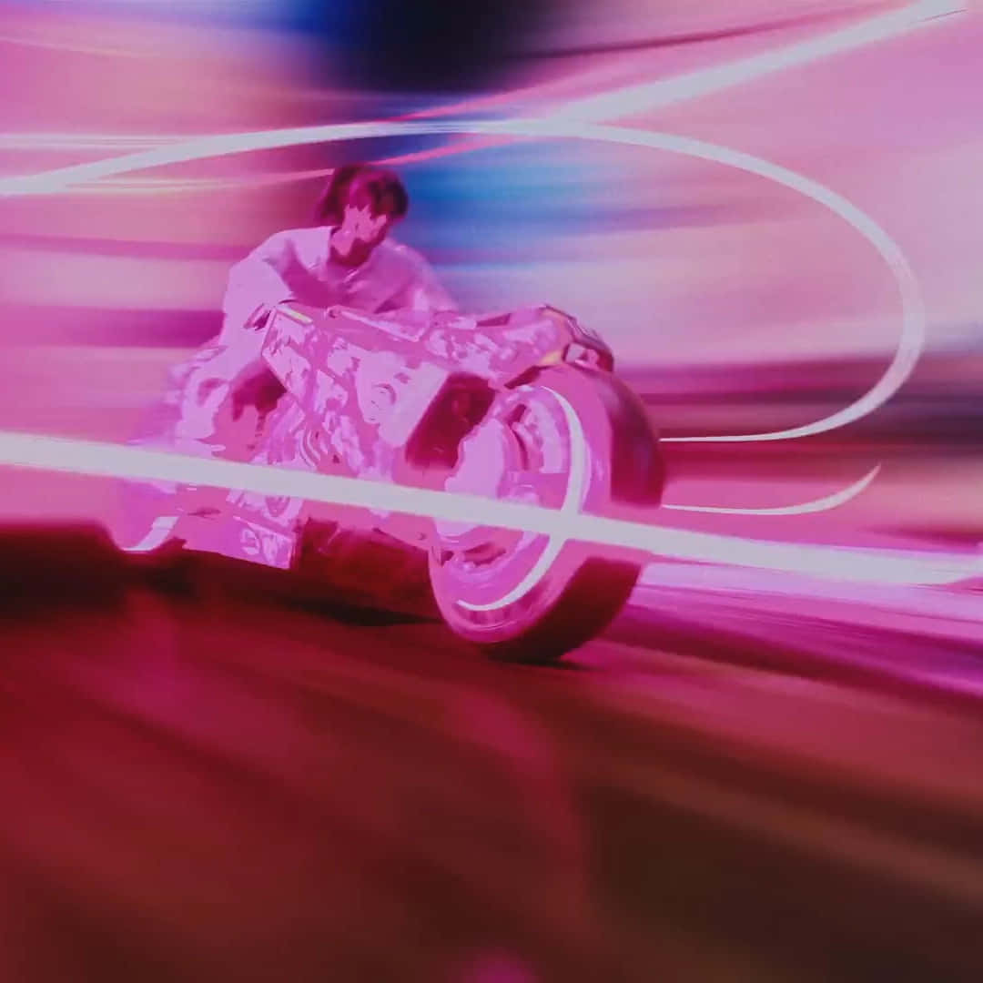 Speeding Motorcyclein Pink Hues Wallpaper