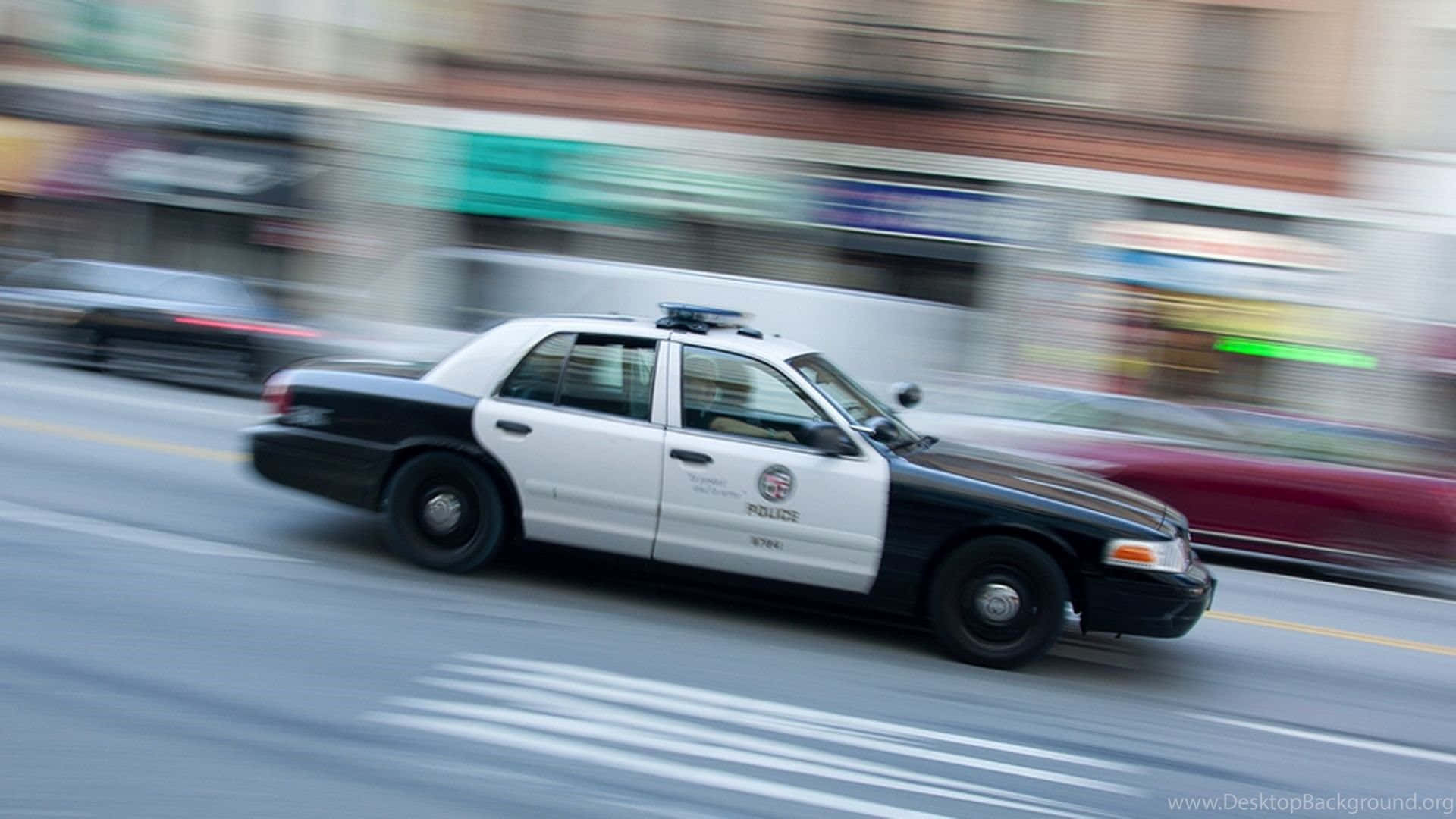 Speeding Police Carin City Motion Blur Wallpaper