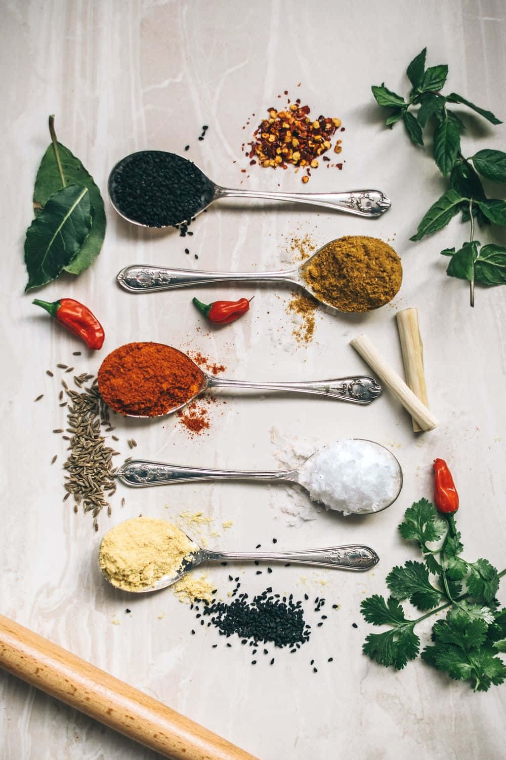 Spices And Herbs In Spoons