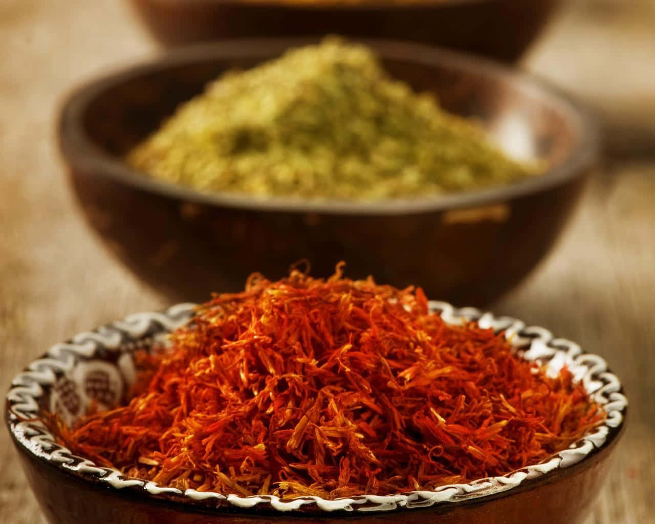 Saffron In Bowls On A Wooden Table