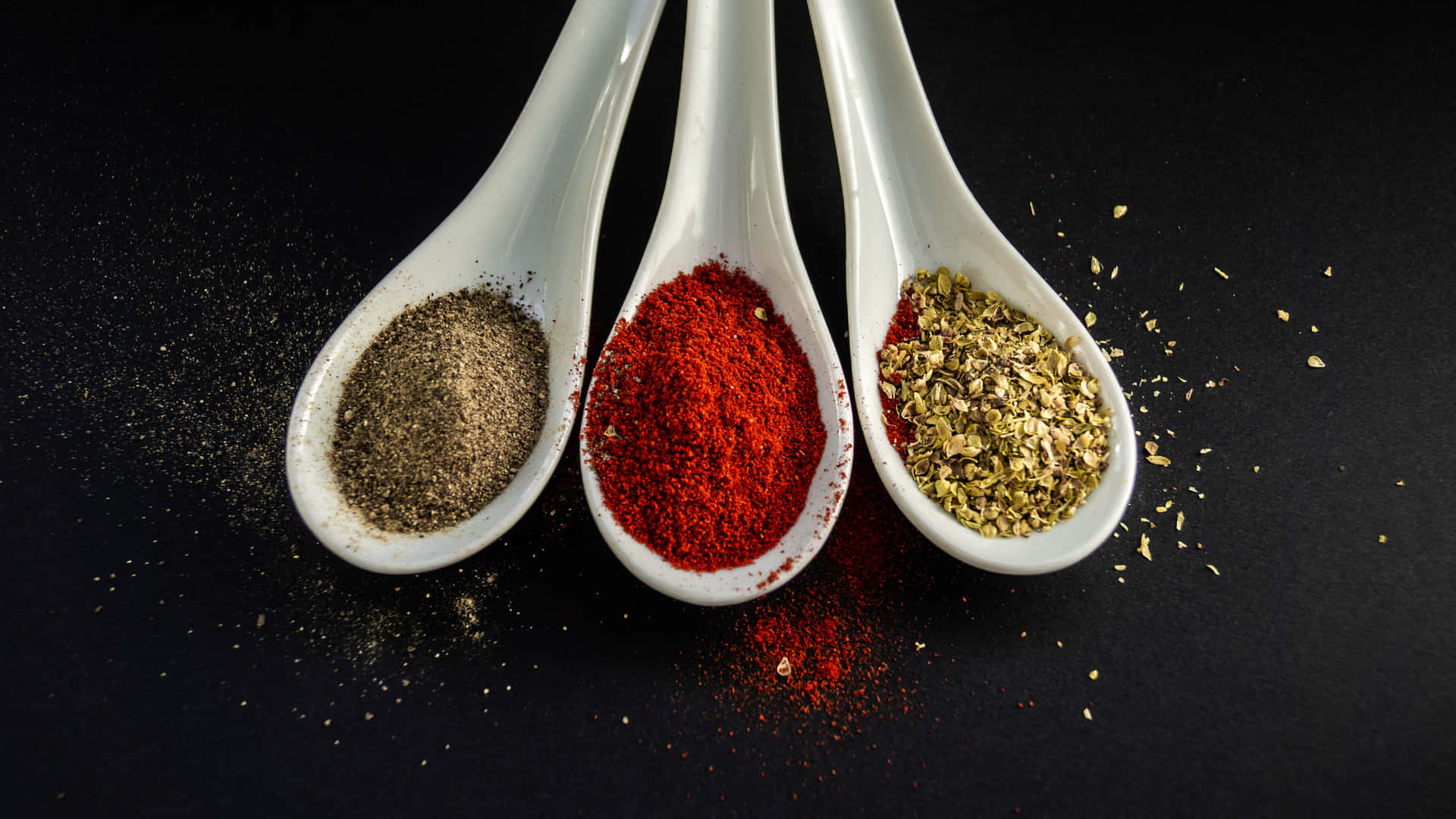 A selection of aromatic spices in wooden bowls