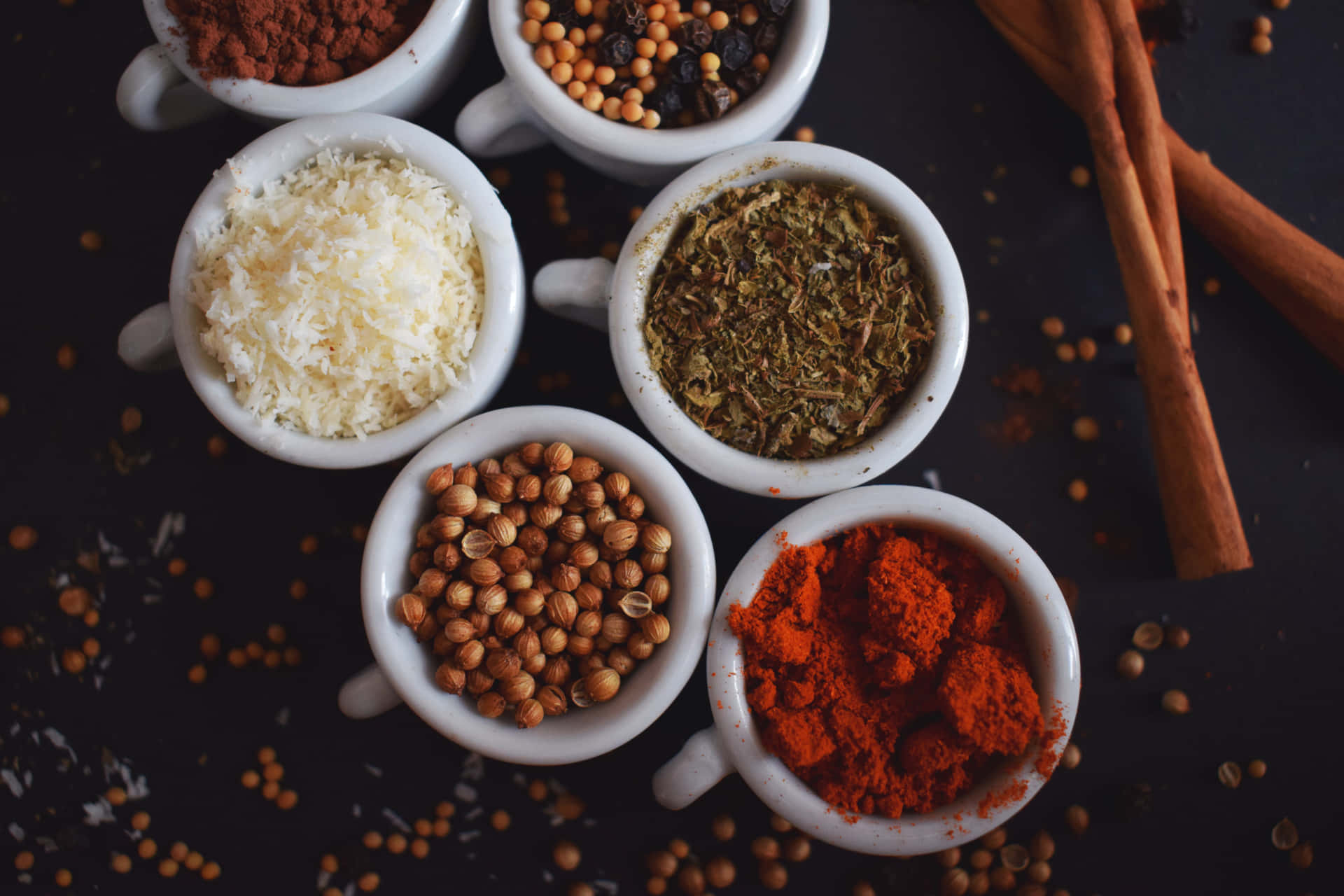 Spices In Bowls On A Dark Background