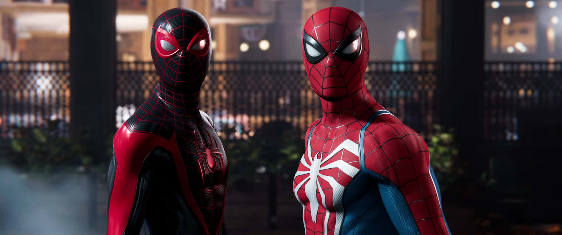 Two Spider - Man Characters Standing Next To Each Other Wallpaper