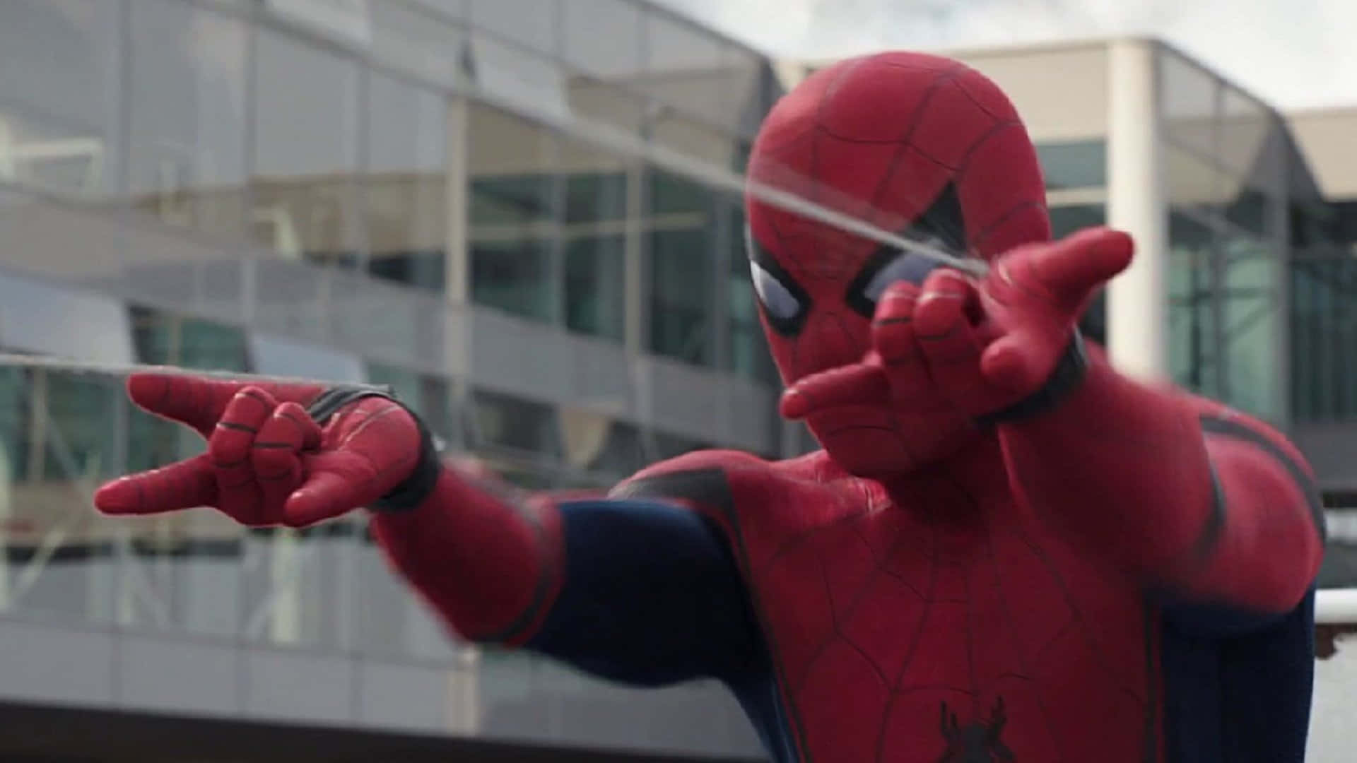 Spider-Man Skillfully Using Web Shooter Wallpaper