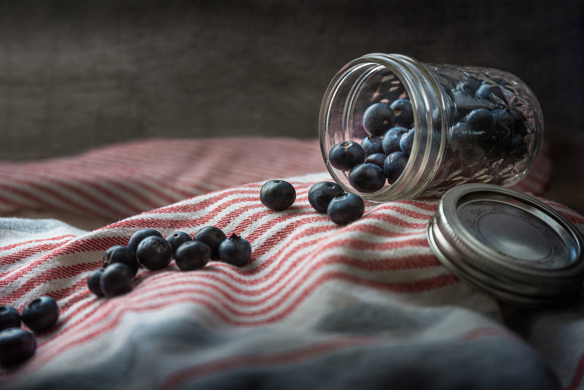 Spilled Jar Of Blueberries Wallpaper