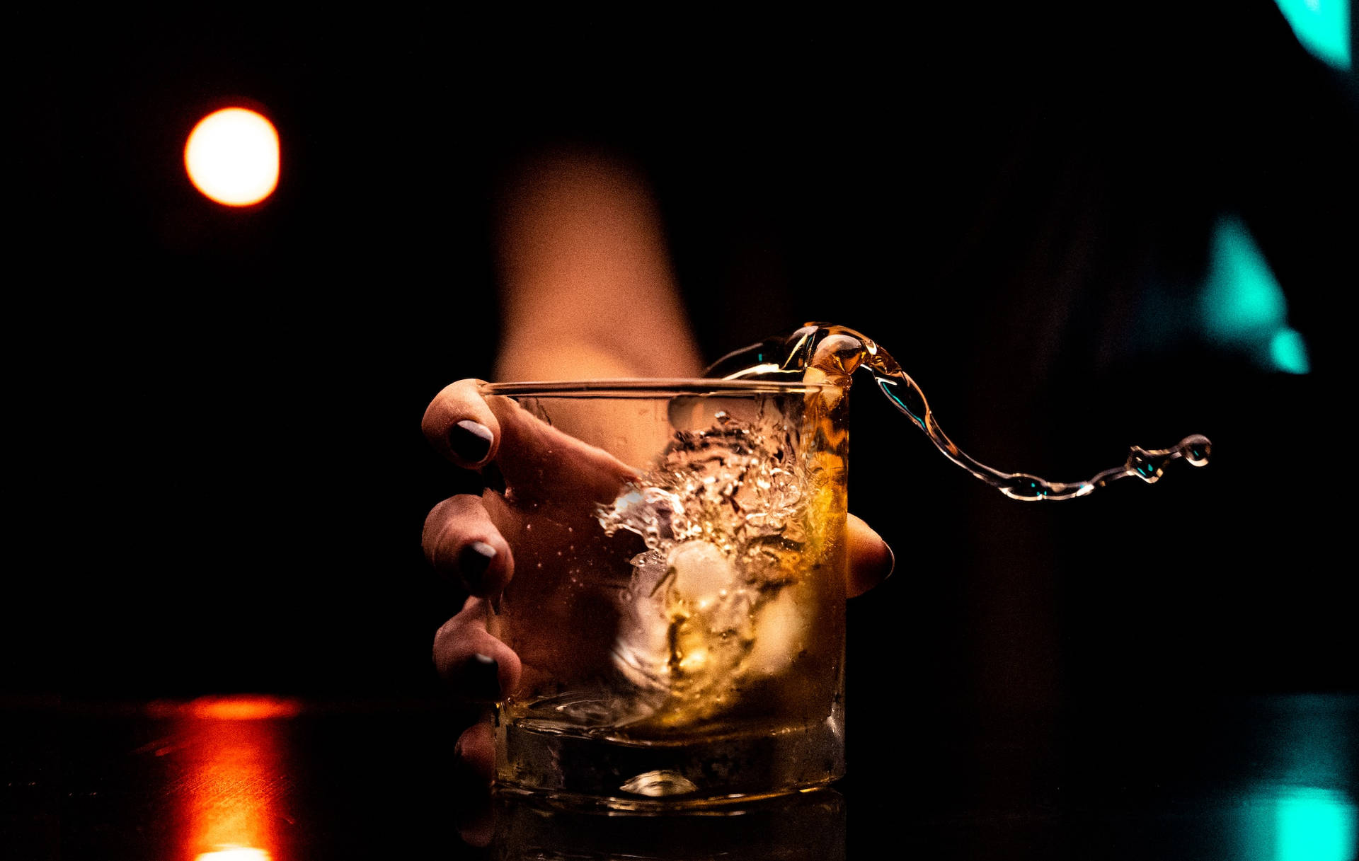 Spilling Whiskey Drink In Glass Wallpaper