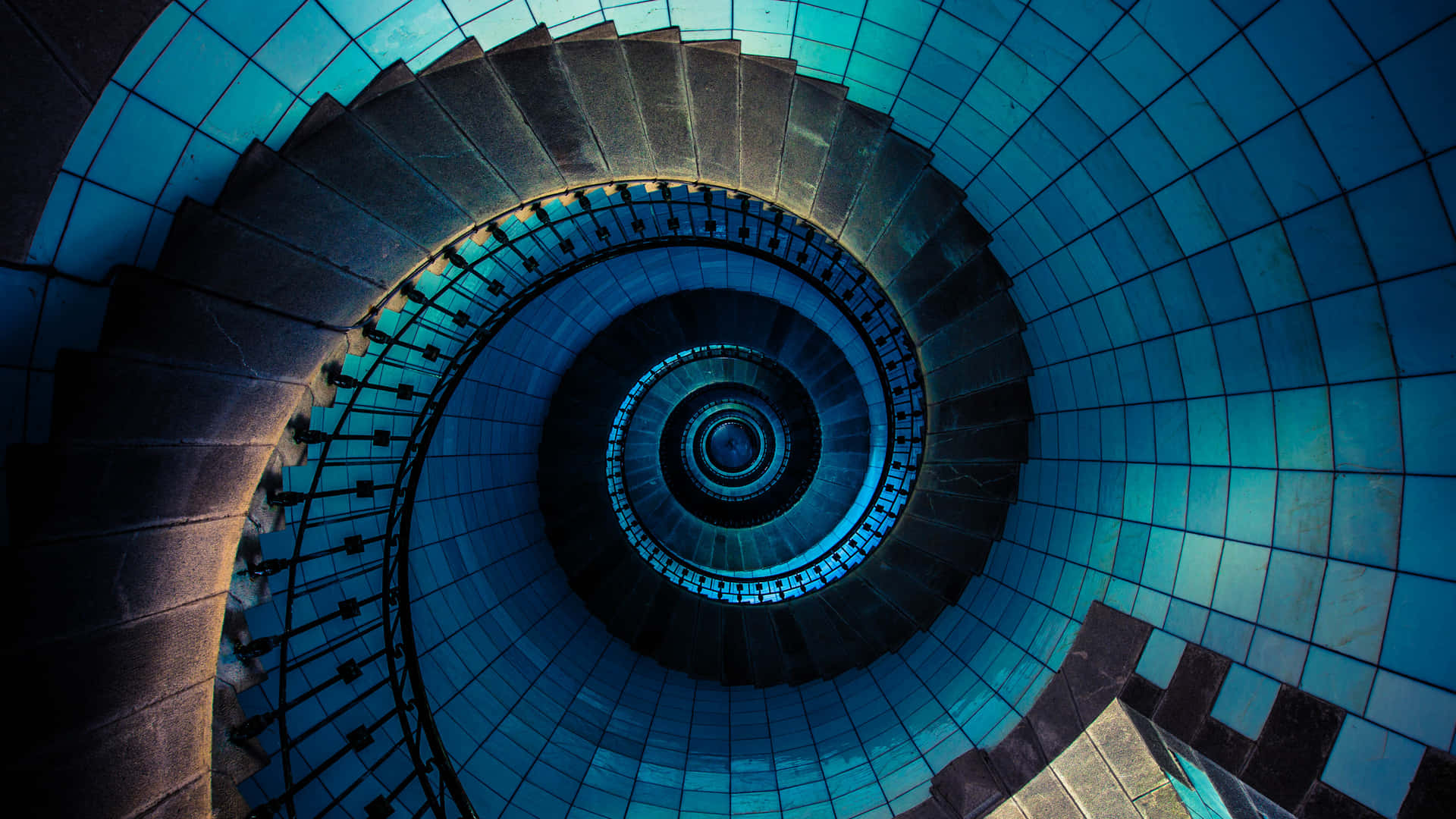 A Spiral Staircase With Blue Lights
