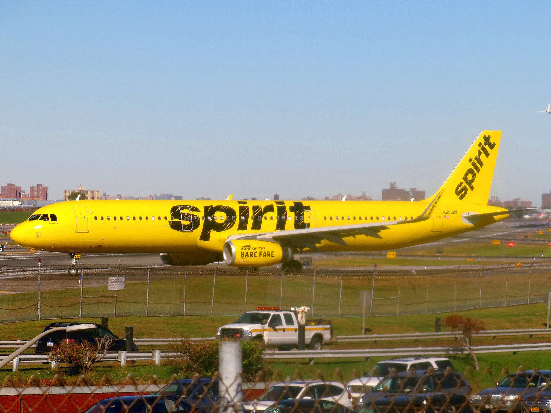 Spirit Airlines Plane Beside A Road Background