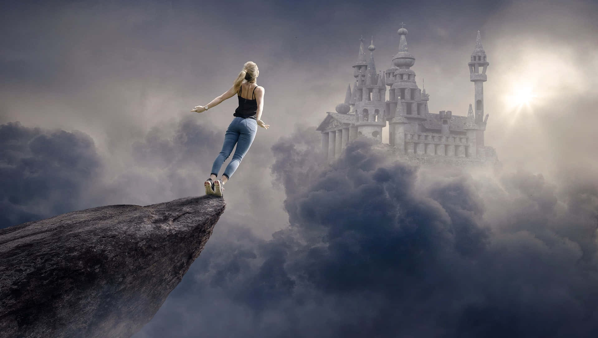 A Woman Standing On A Cliff With A Castle In The Background Wallpaper