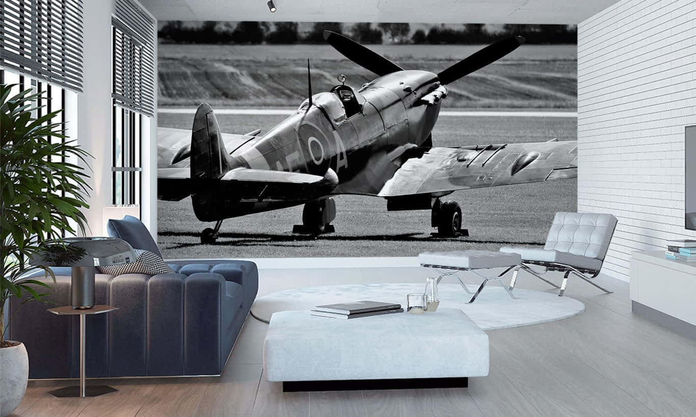Et ikonisk Spitfire flyver gennem himlen - Wallpaper