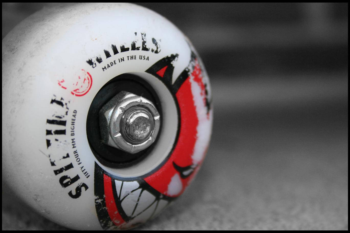 Spitfire Logo Face On Skateboard Wheel Background