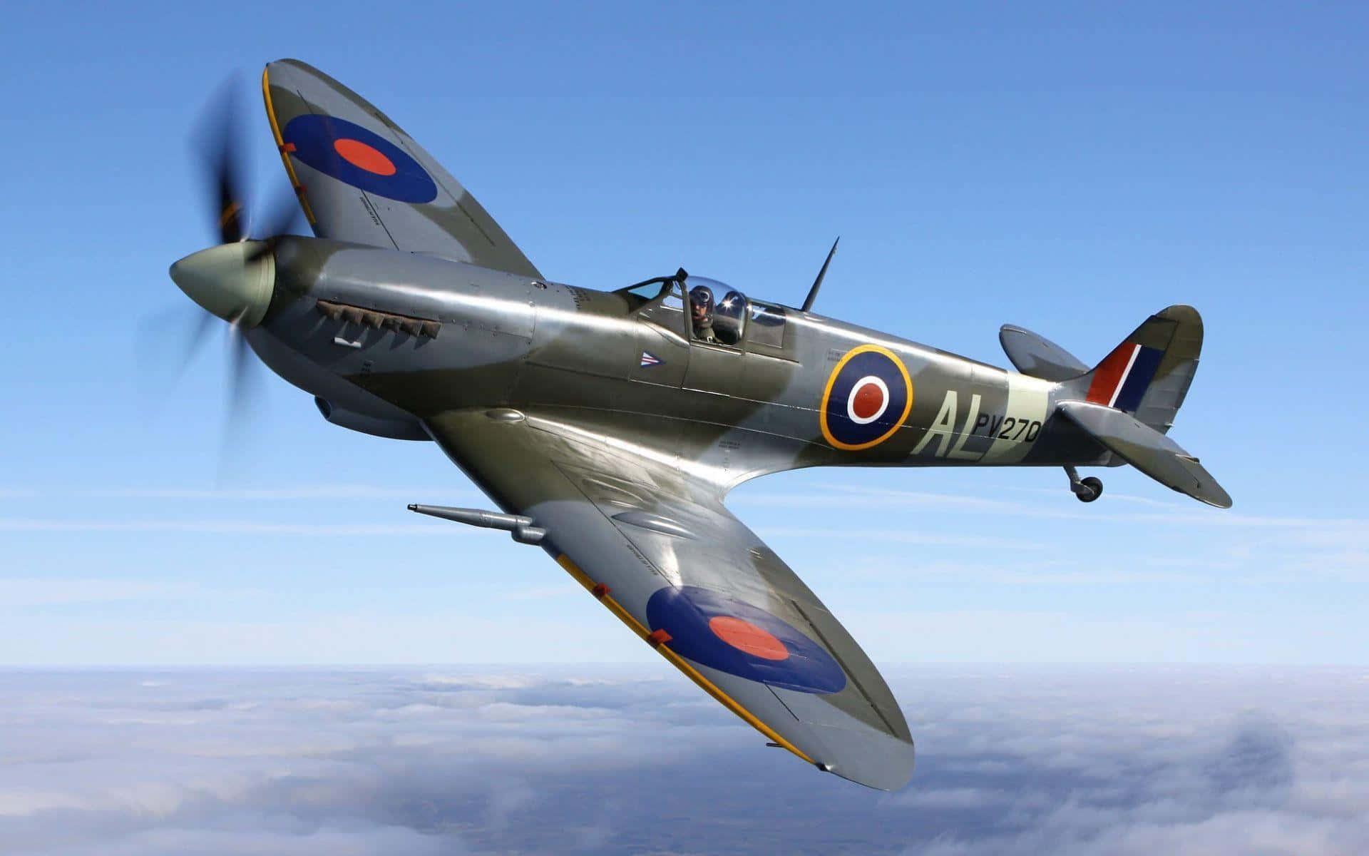 Vuelapor Los Cielos En Un Avión De Combate Spitfire. Fondo de pantalla