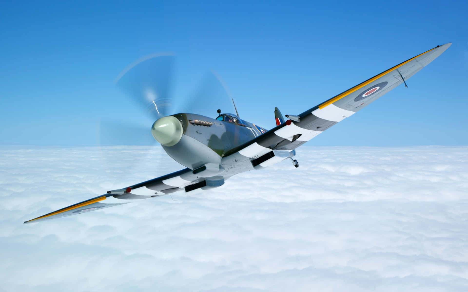 A Vintage Fighter Plane Flying Through The Clouds Wallpaper