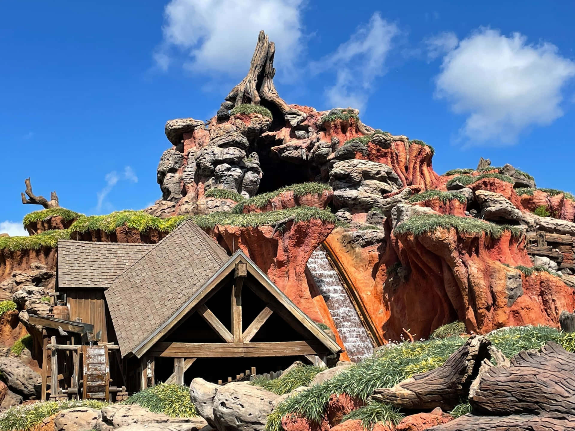 "Climb Aboard for a Thrilling Adventure Down Splash Mountain!"