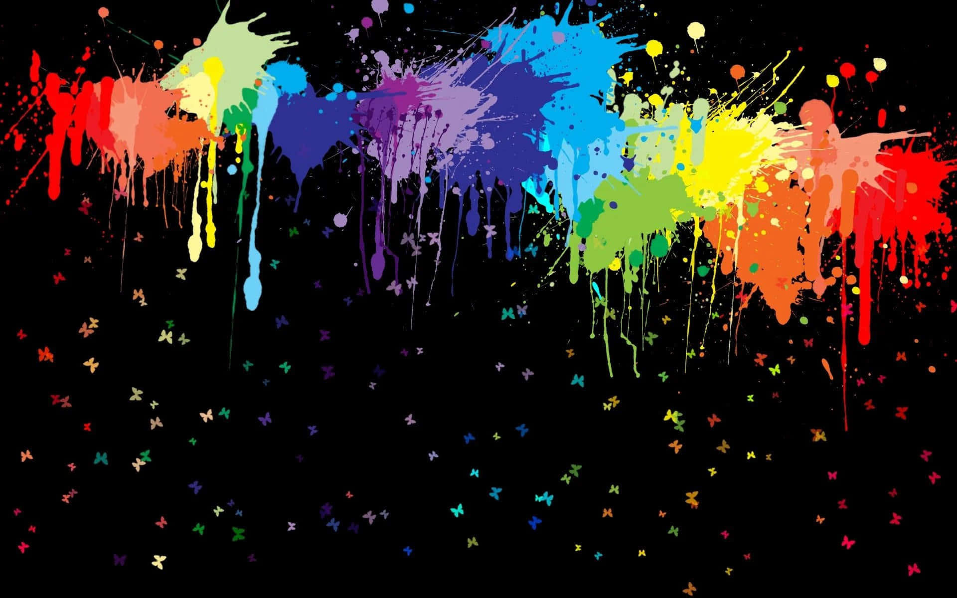 An abstract multicolored splash of paint on a black background
