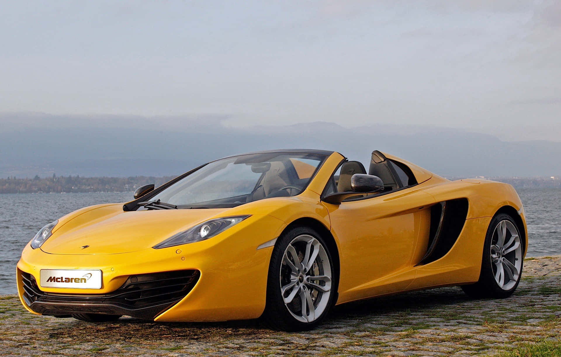 Splendid Silver Mclaren Mp4-12c Cruising Open Roads Wallpaper