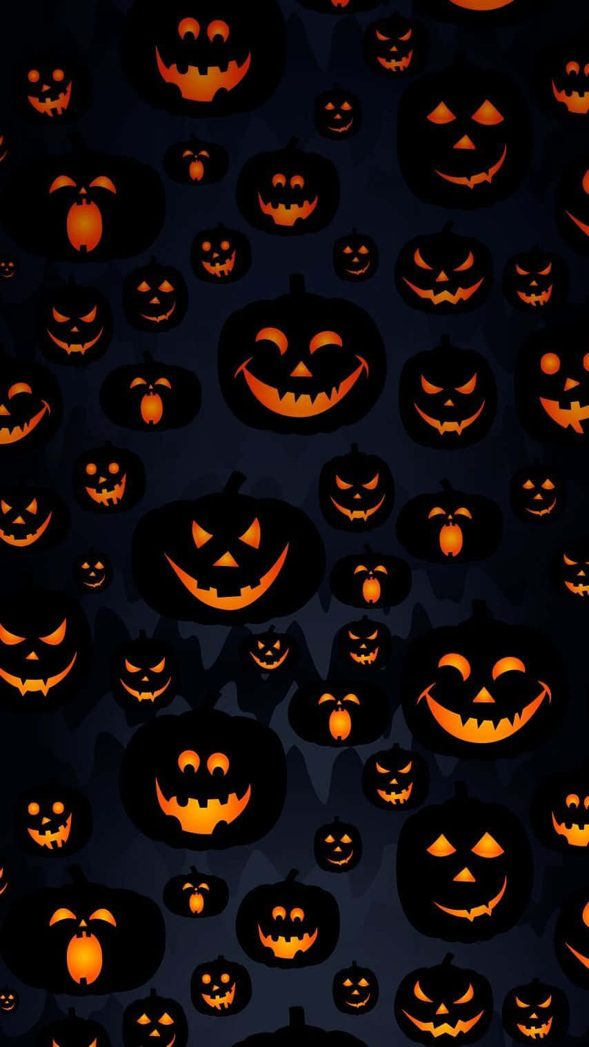 Halloween Pumpkins On A Dark Background Wallpaper