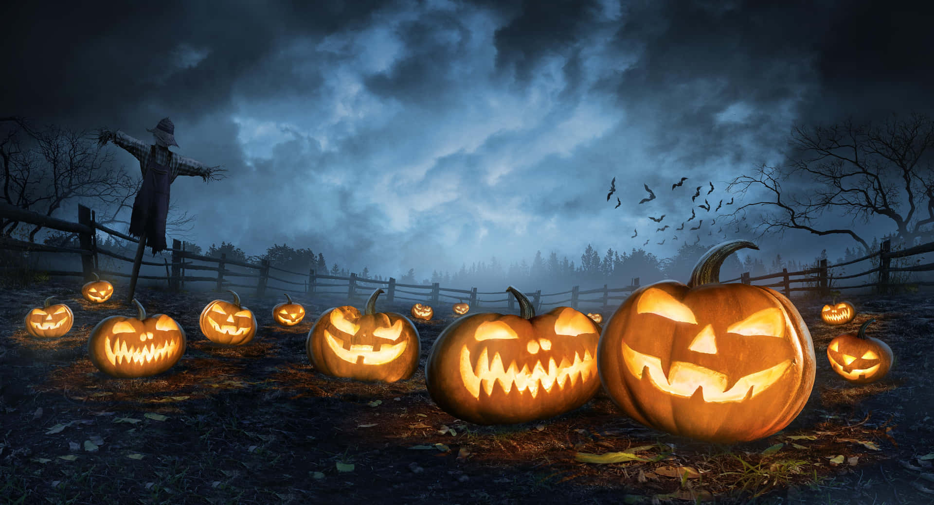Spooky Jack O Lanterns Night Scene Wallpaper