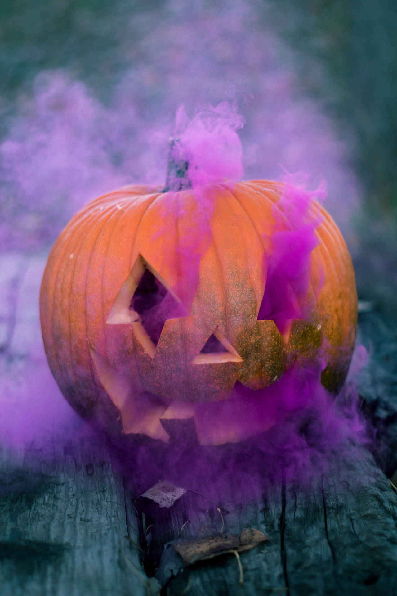 Spooky Pumpkin With Purple Smoke Background