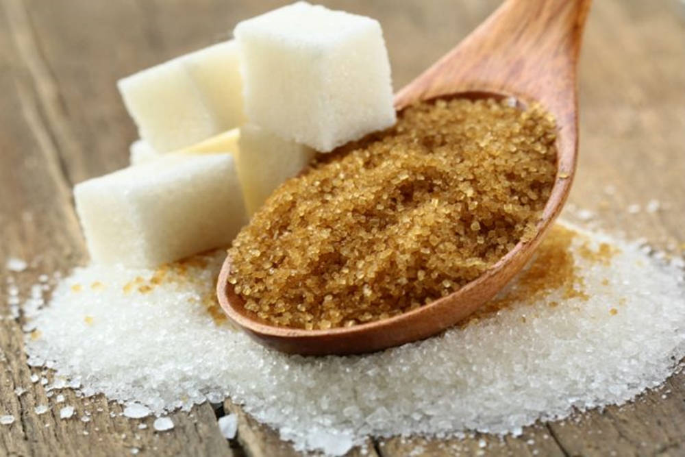 Spoonful Of Brown Sugar With White Cubes Aesthetic Wallpaper