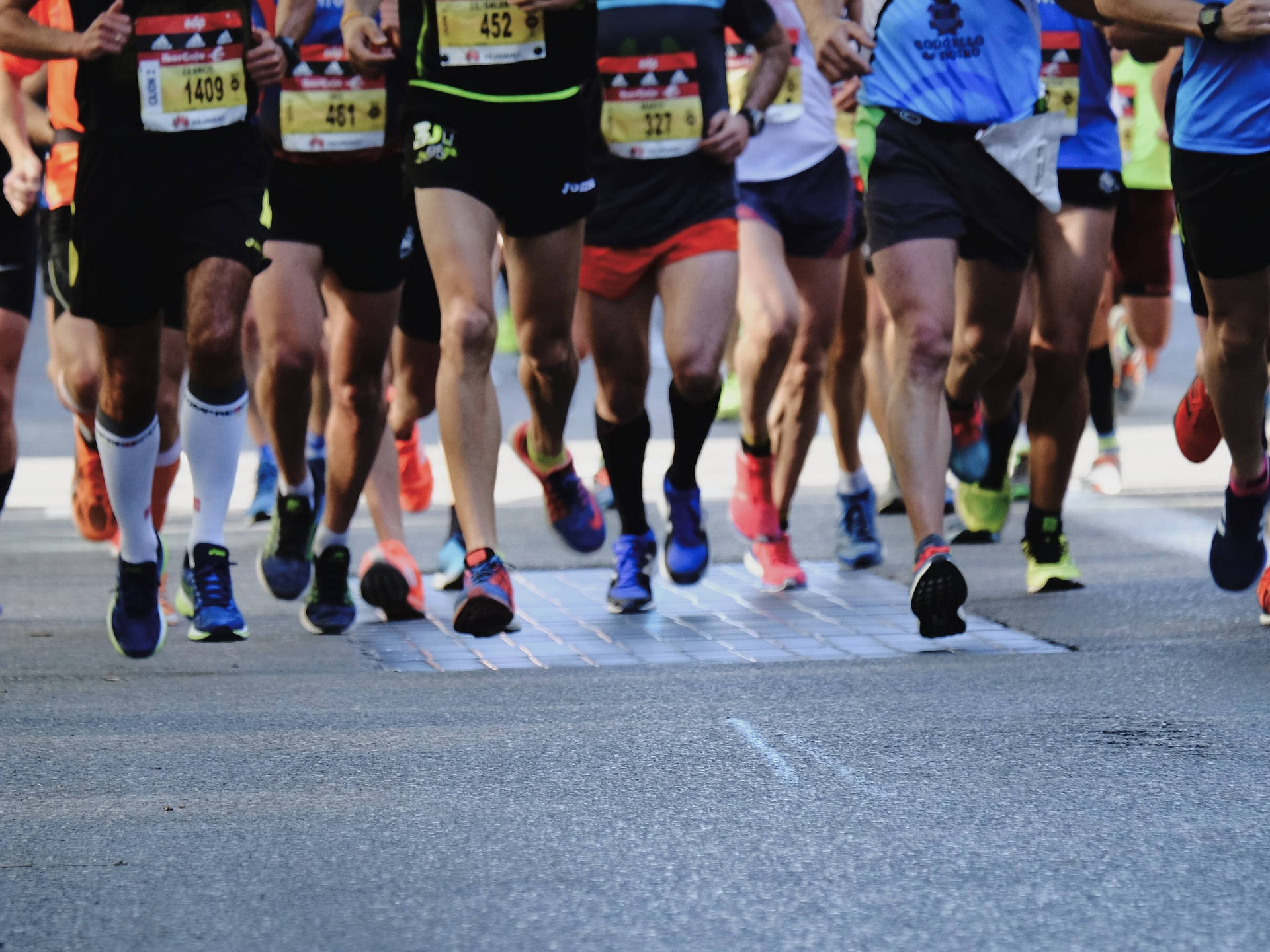 Deportistascorriendo En Un Maratón. Fondo de pantalla