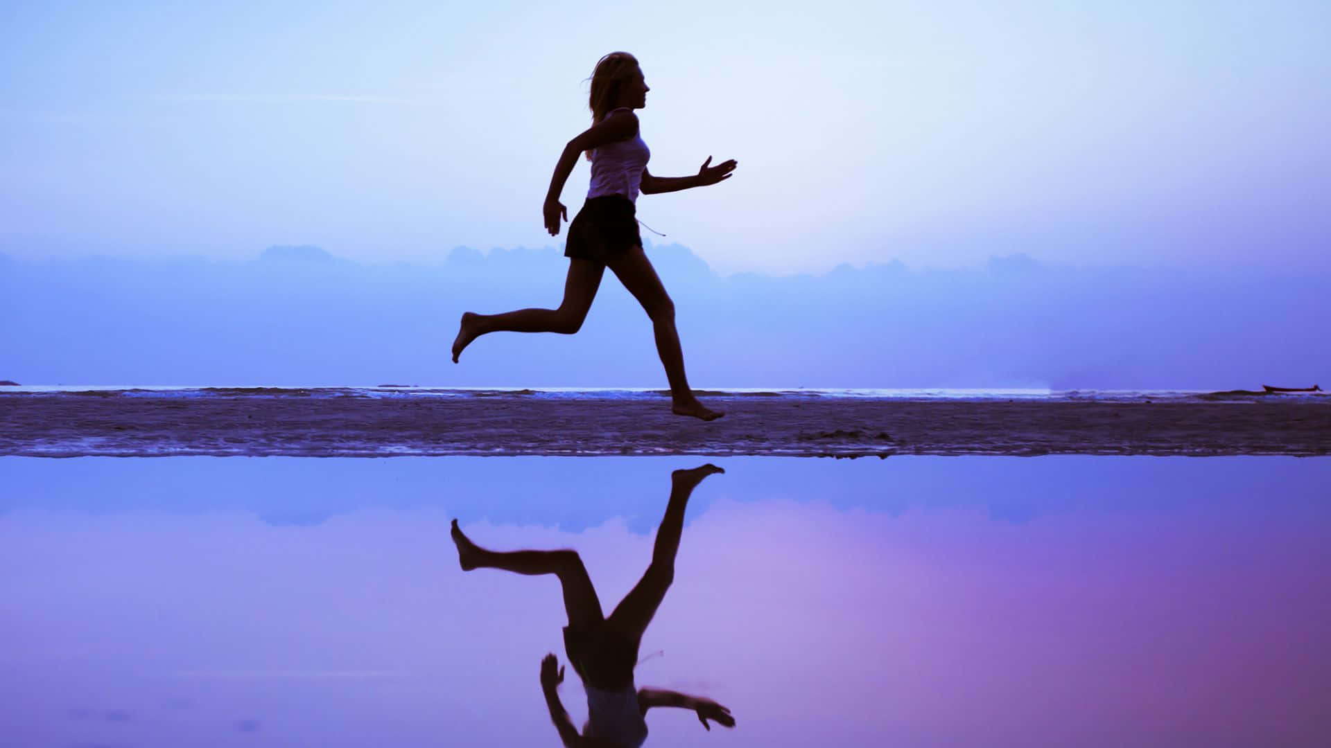 Woman Running Along The Shore Sports Background