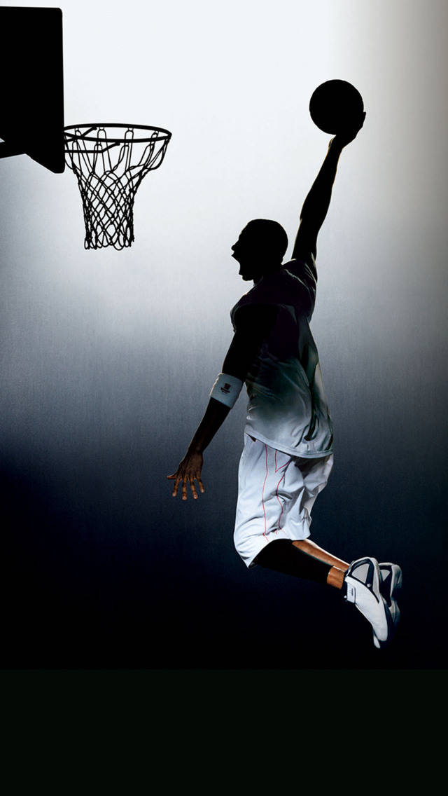 Silhouette Of A Man Dunking Sports iPhone Wallpaper
