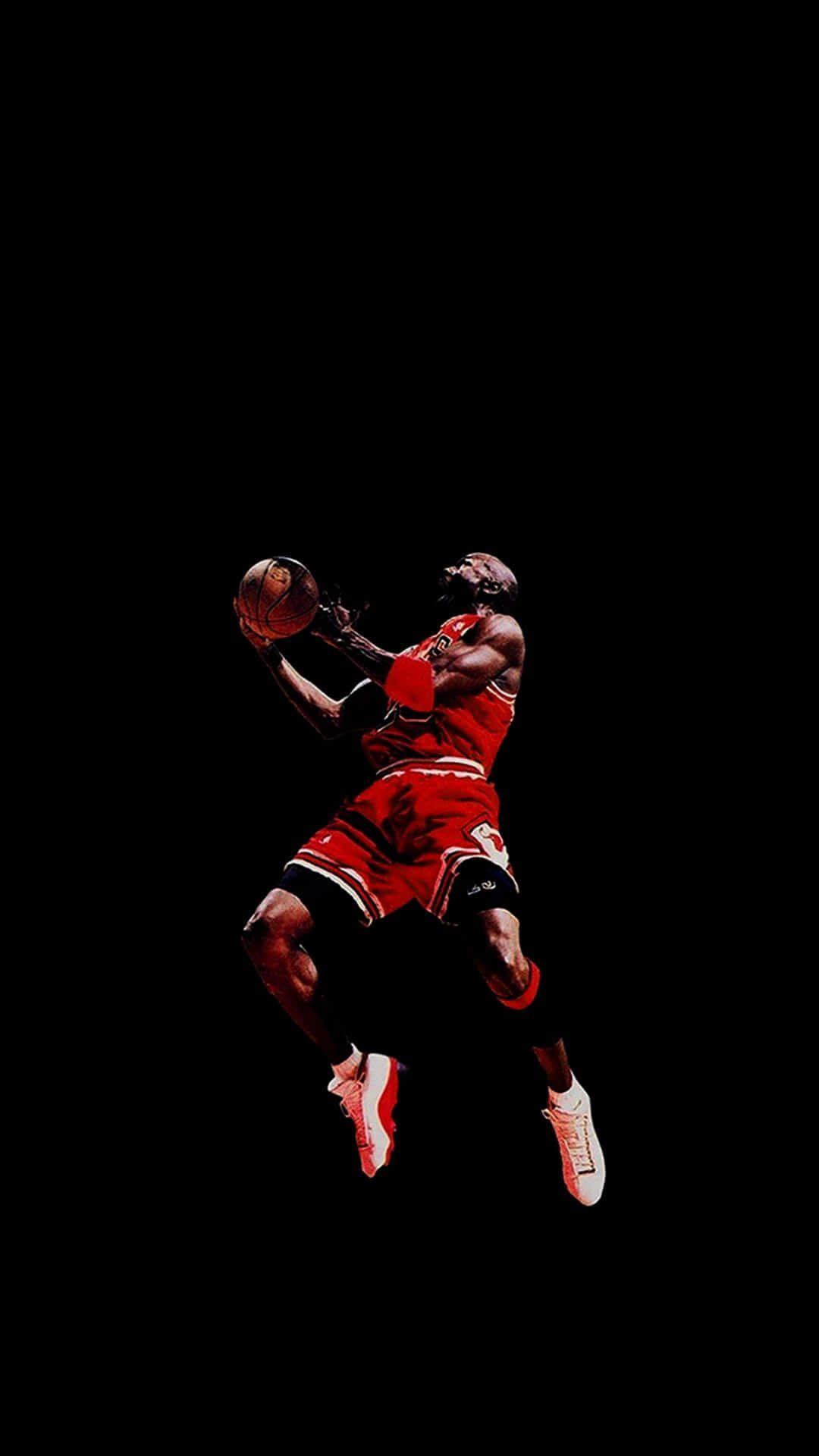 A Basketball Player Is Jumping In The Air Wallpaper