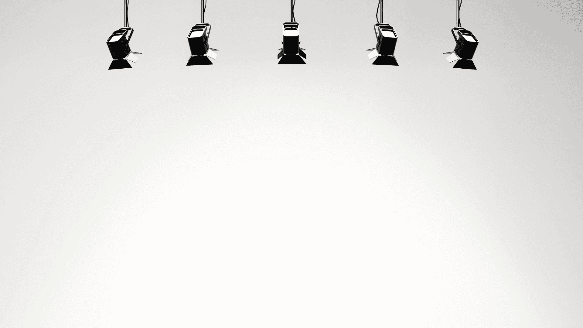 Five Spotlights Hanging From A White Background
