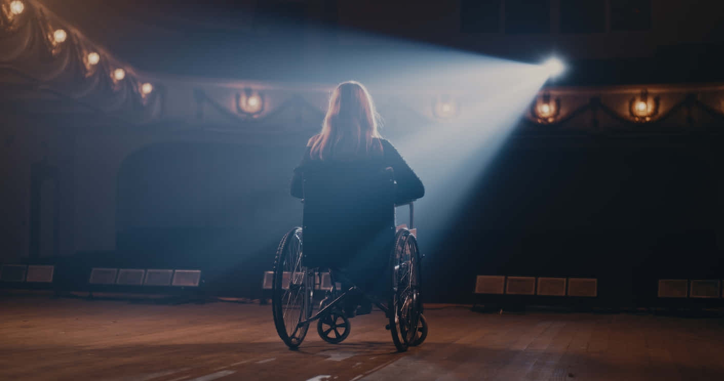 Spotlighton Wheelchair Performer Stage Wallpaper