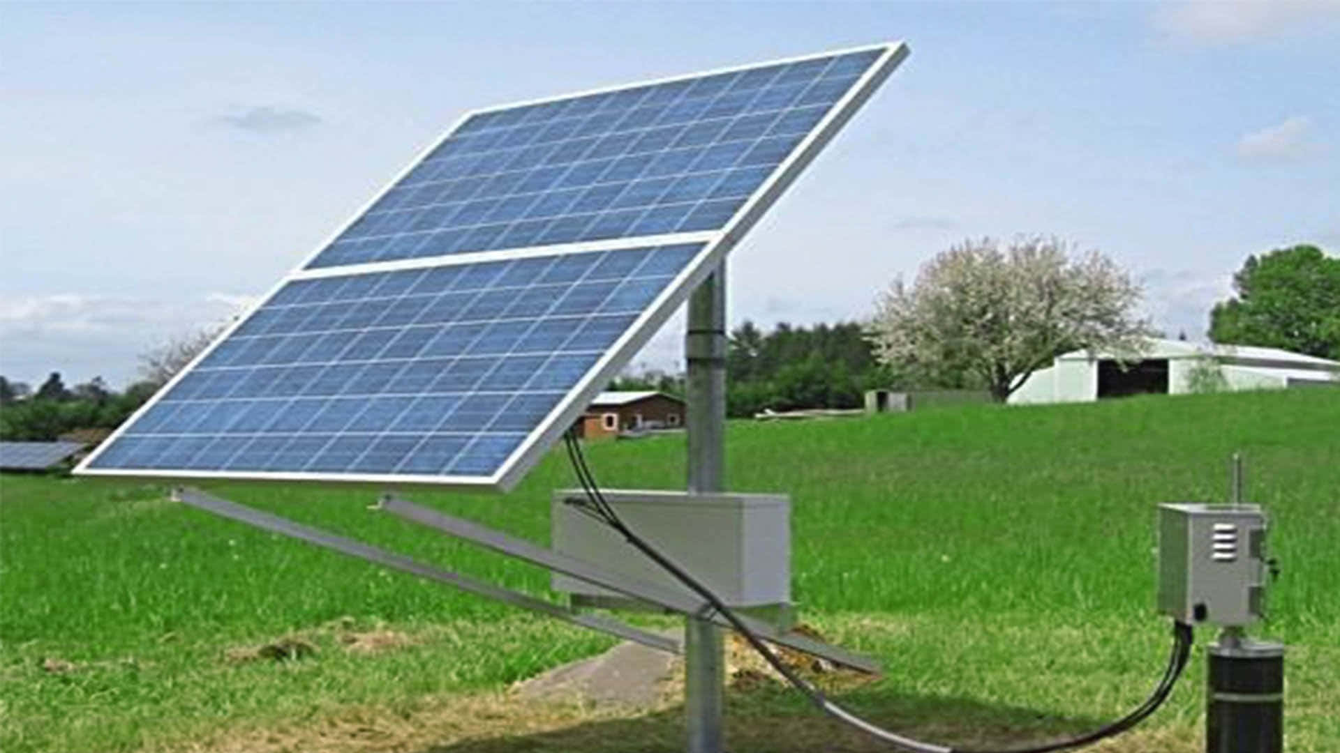 Sprawling Solar Panel Installation On A Sunny Day Wallpaper