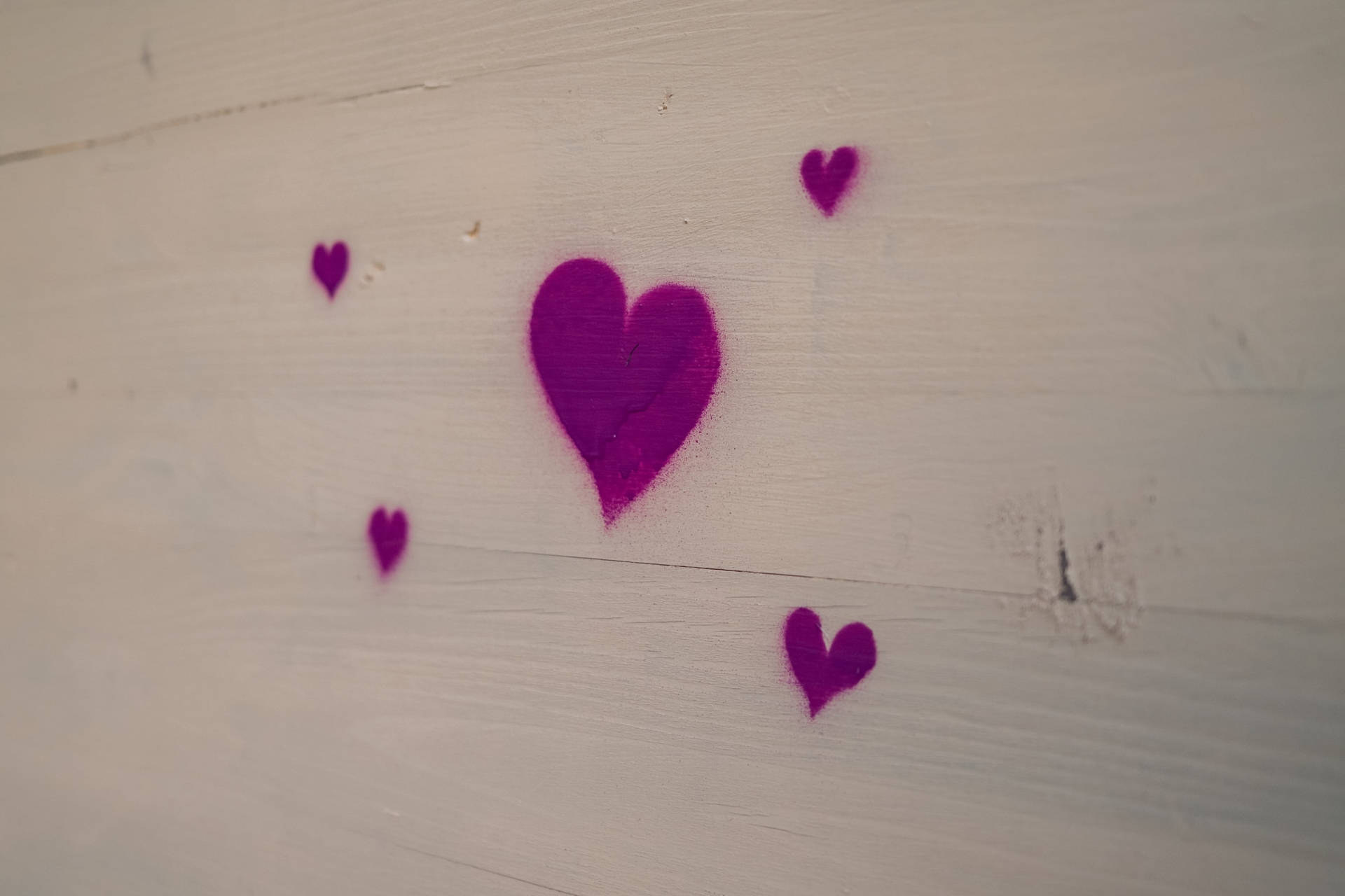 Spray Painted Purple Heart White Wooden Wall Wallpaper