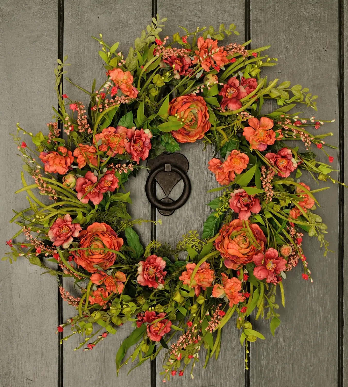 Caption: Colorful Spring Wreath on a White Door Wallpaper