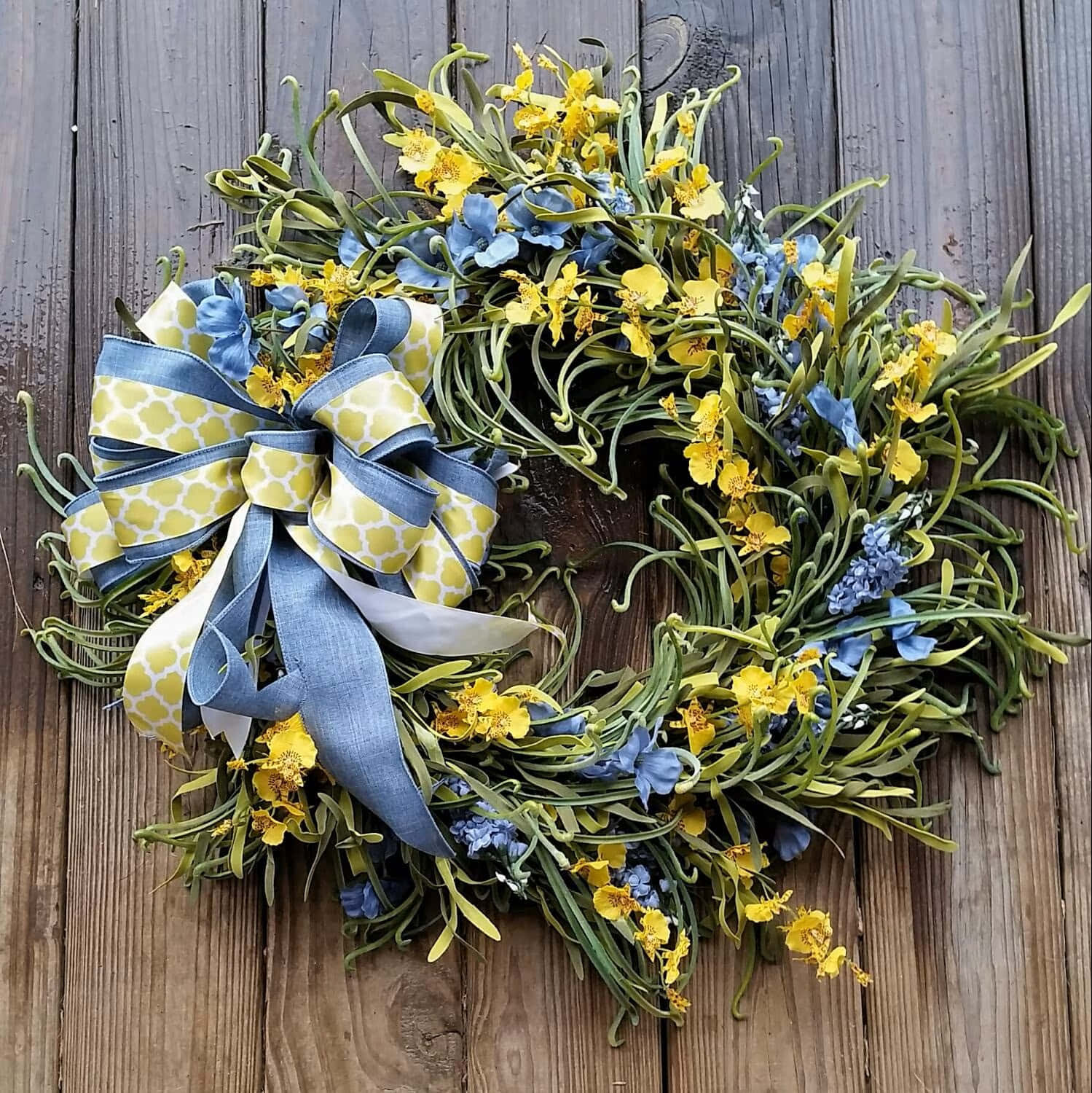 Beautiful Spring Wreath on a Wooden Background Wallpaper