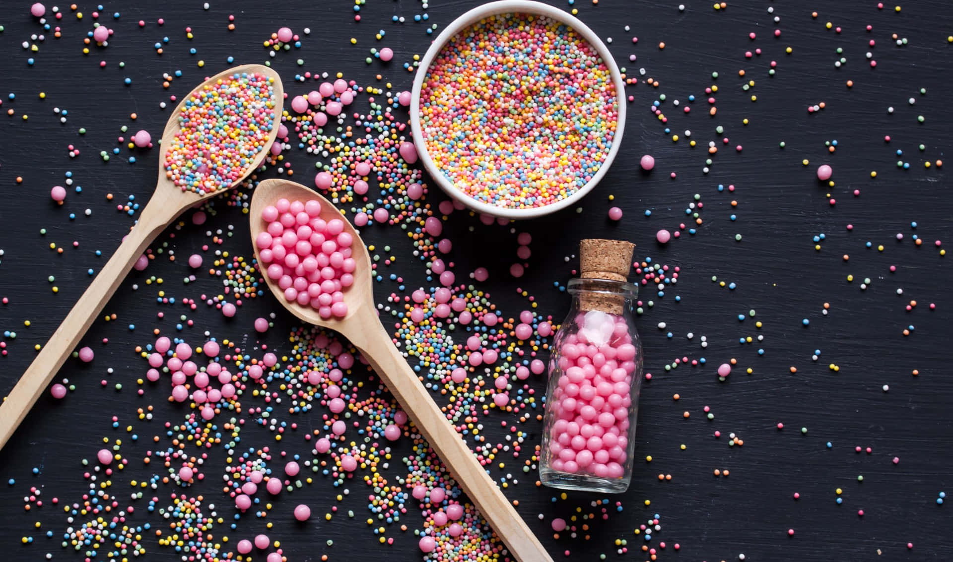 Pink Sprinkles And Round Candies Background