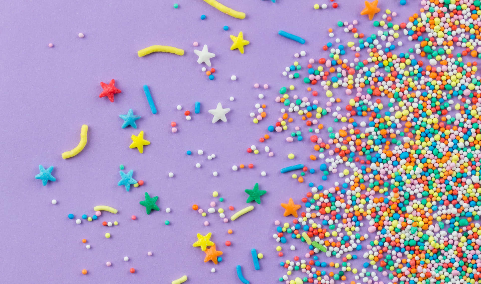 Colorful sprinkles adding a fun and vibrant aesthetic to the background.