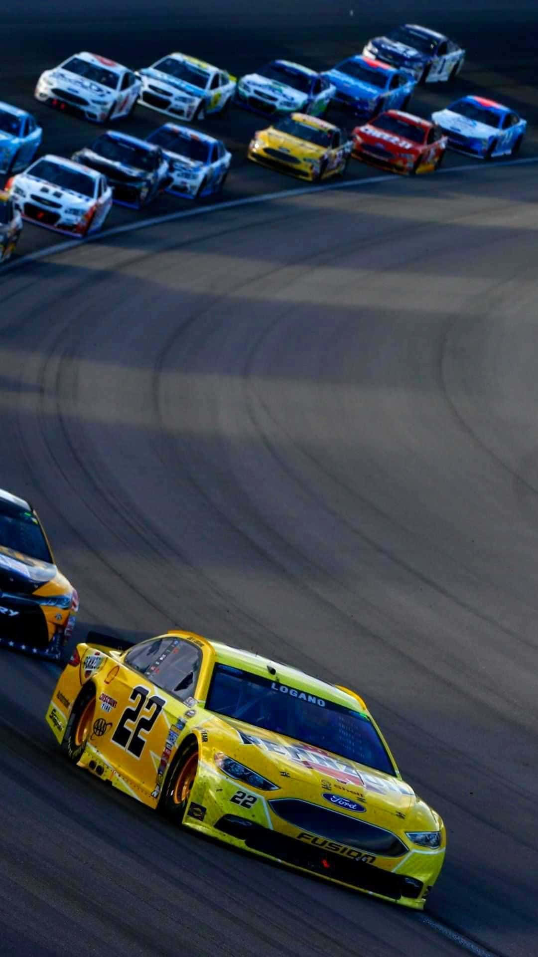 Nascar Drivers Racing On A Track Wallpaper