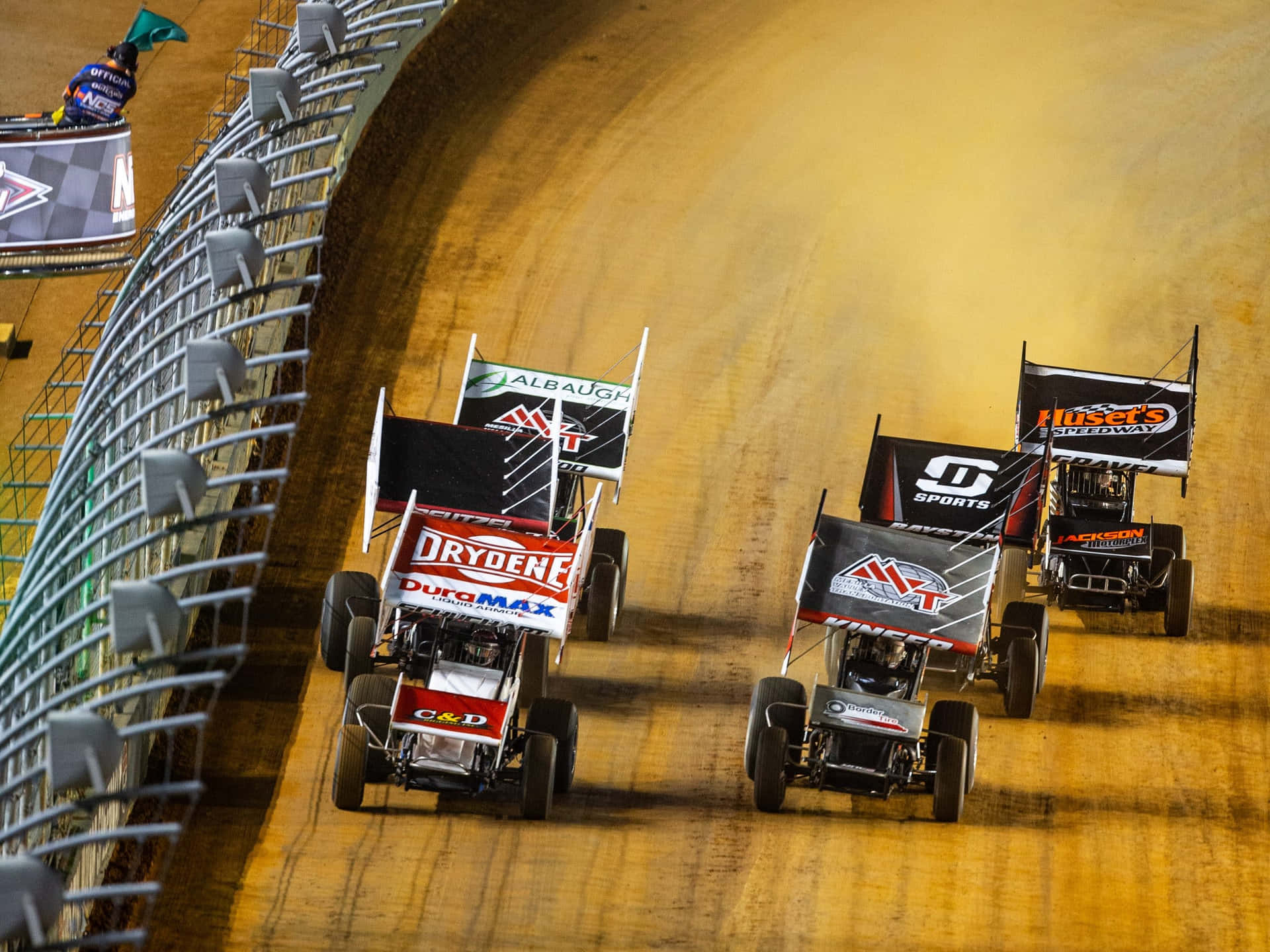 A Group Of Dirt Track Cars Racing Wallpaper