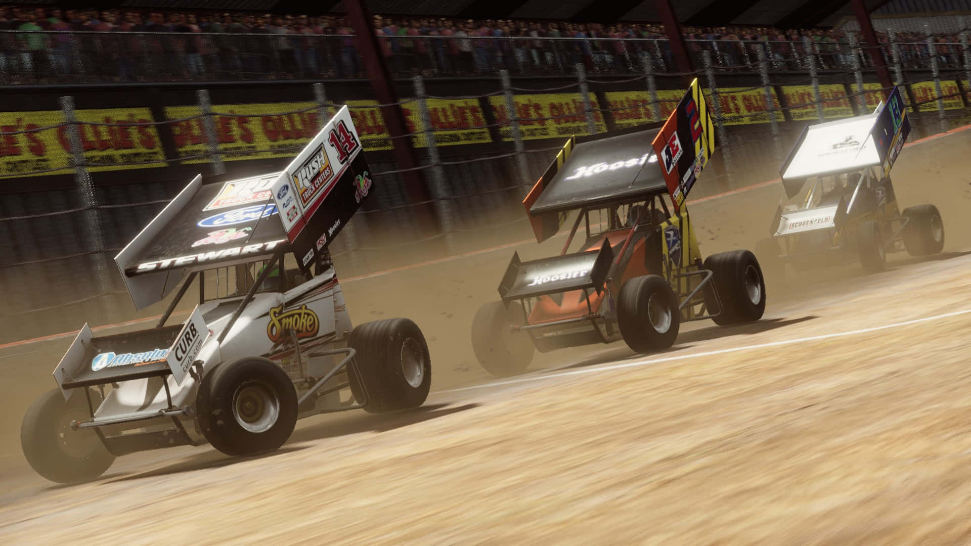 A Group Of Dirt Track Racing Cars Are Racing In A Race Wallpaper