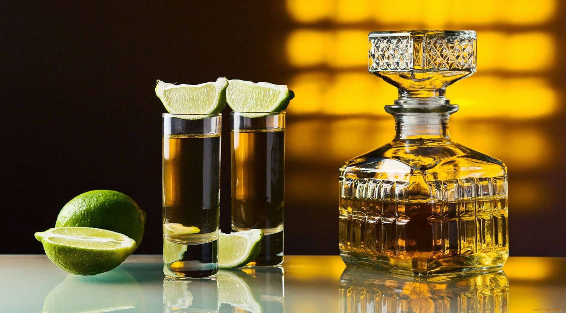 Square Tequila Bottle With Limes Wallpaper